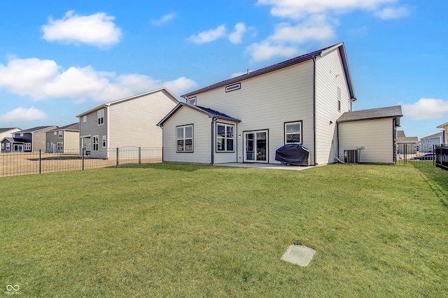 rear view of property with central AC unit, a lawn, a patio, and a fenced backyard