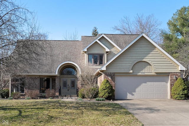 view of front of property with driveway, a shingled roof, a front lawn, a garage, and brick siding