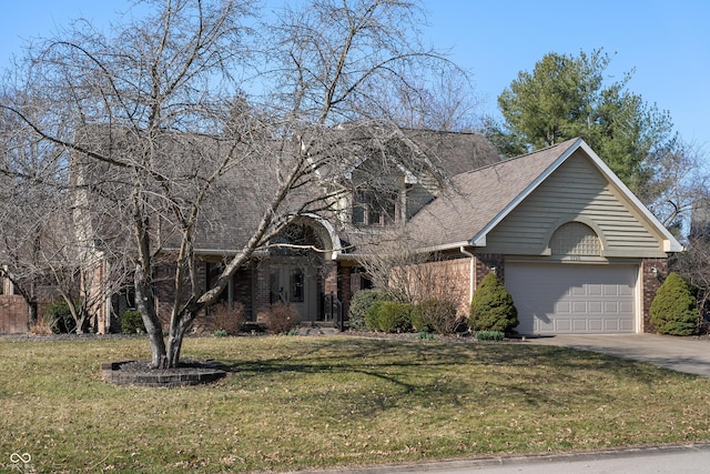 traditional-style house featuring a front lawn, concrete driveway, brick siding, and an attached garage