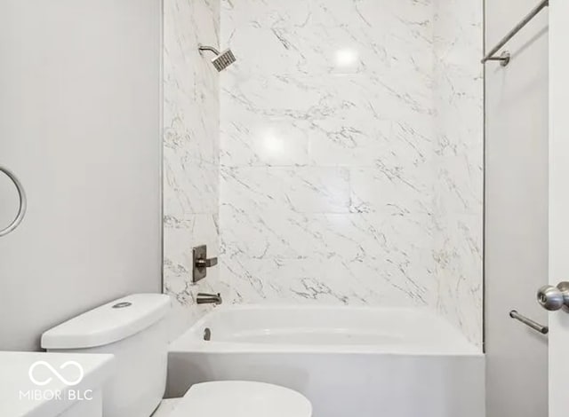 bathroom featuring toilet and shower / bath combination