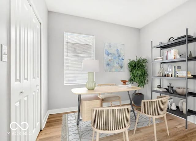 office area with light wood-type flooring and baseboards