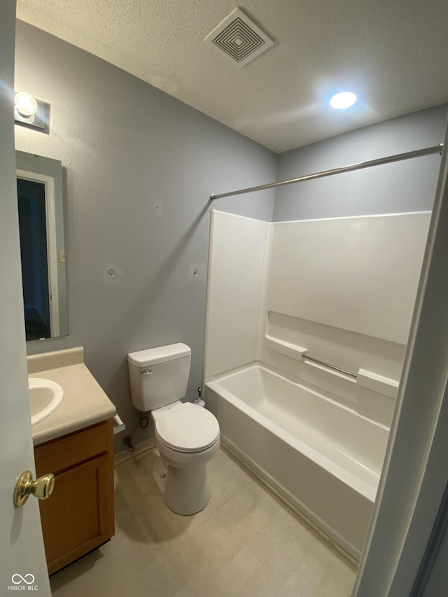 bathroom with visible vents, toilet, shower / tub combination, tile patterned floors, and vanity