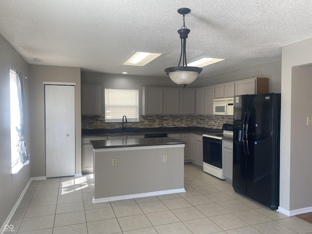 kitchen with white microwave, range with electric stovetop, black refrigerator with ice dispenser, light tile patterned flooring, and a sink