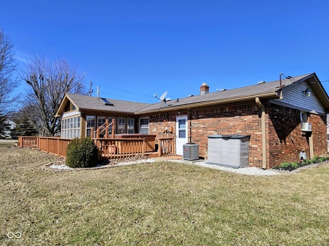 4109 E Epler Ave, Indianapolis, IN 46237 - back of property with a yard, a chimney, brick siding, and a wooden deck