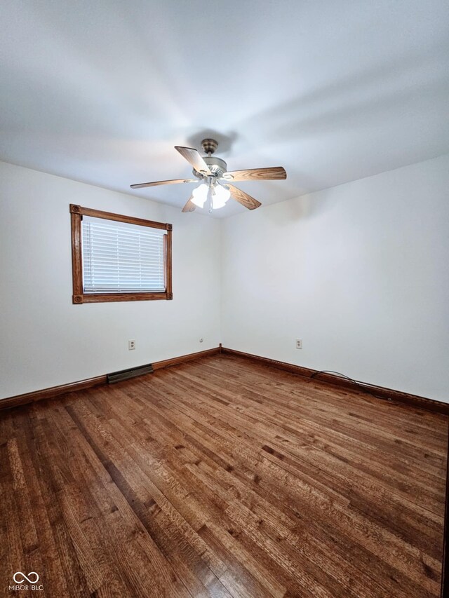 4109 E Epler Ave, Indianapolis, IN 46237 - unfurnished room featuring a ceiling fan, baseboards, and dark wood-style flooring