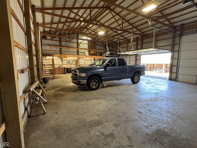 garage with metal wall and a garage door opener