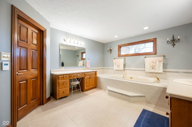 full bathroom with a garden tub, two vanities, recessed lighting, and tile patterned floors