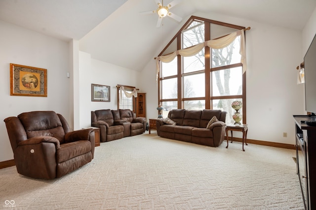 living area featuring light colored carpet, high vaulted ceiling, baseboards, and a ceiling fan