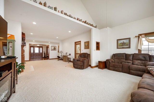 carpeted living room featuring recessed lighting, baseboards, and high vaulted ceiling