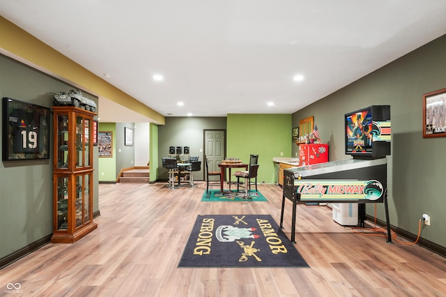 recreation room with recessed lighting, baseboards, and wood finished floors