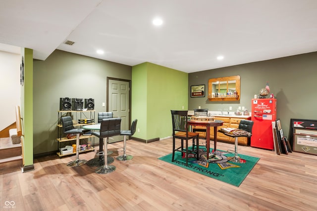 home office featuring recessed lighting, visible vents, light wood finished floors, and baseboards