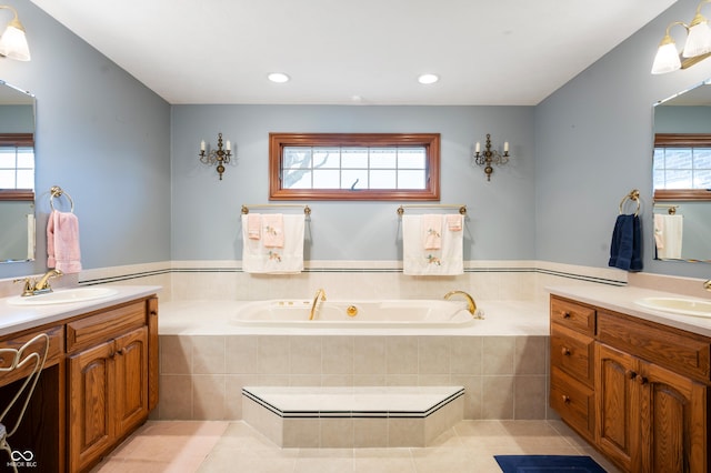 bathroom featuring a bath, a wealth of natural light, and a sink