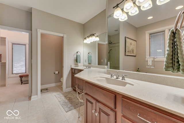 full bathroom with baseboards, toilet, tile patterned floors, an enclosed shower, and vanity