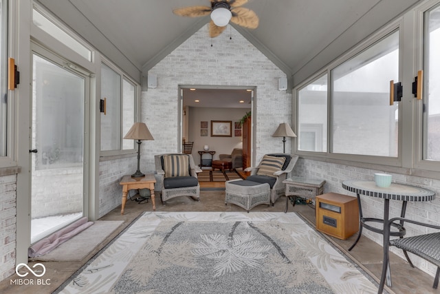 sunroom / solarium with vaulted ceiling and a ceiling fan