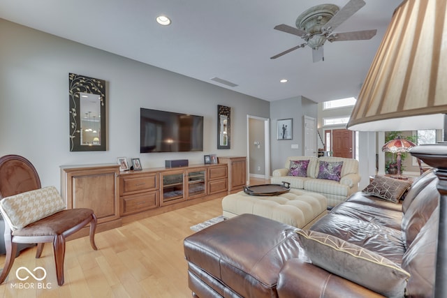 living room featuring a ceiling fan, recessed lighting, visible vents, and light wood finished floors