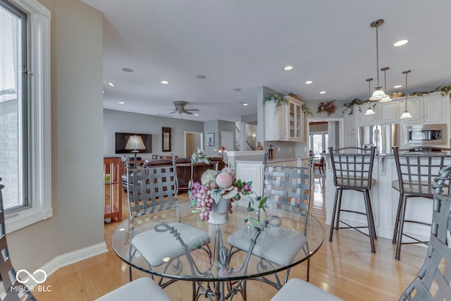 dining room with recessed lighting, light wood-style flooring, baseboards, and ceiling fan