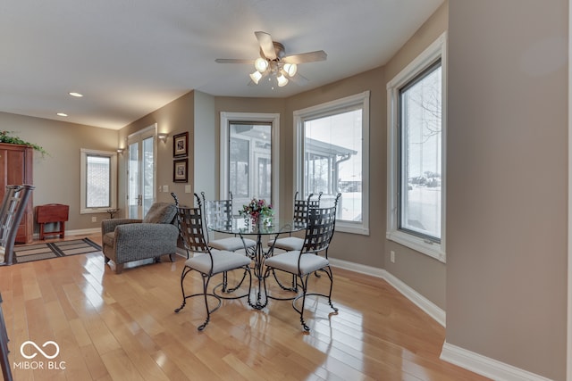 dining space with light wood finished floors, recessed lighting, baseboards, and ceiling fan