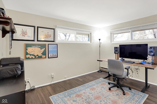 home office featuring plenty of natural light, wood finished floors, and baseboards