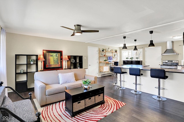 living area with dark wood finished floors and a ceiling fan