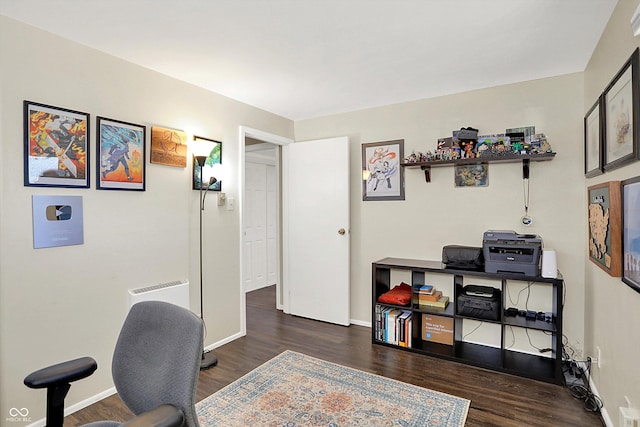 home office with baseboards and wood finished floors