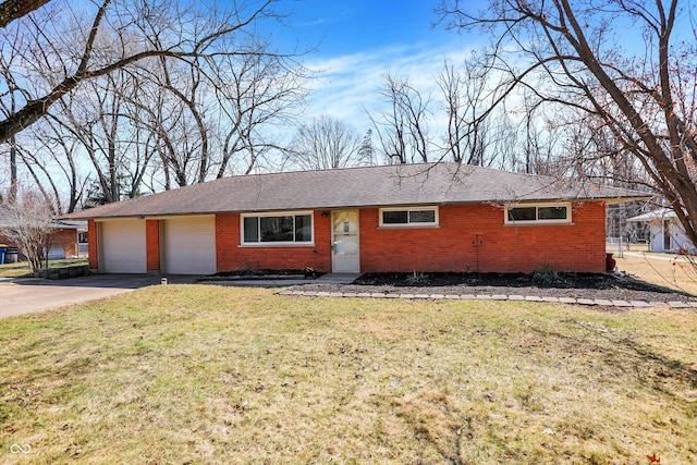 ranch-style home featuring driveway, roof with shingles, an attached garage, a front lawn, and brick siding