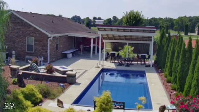 outdoor pool featuring a patio and a pergola