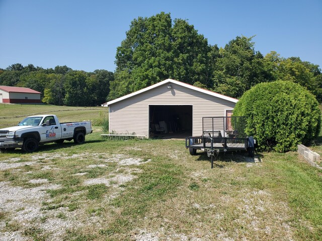 view of pole building with a lawn