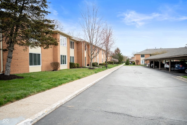 view of street featuring sidewalks, a residential view, and curbs