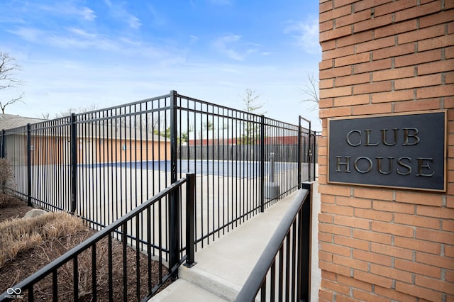 view of gate with fence