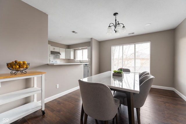 dining room with visible vents, baseboards, an inviting chandelier, and dark wood-style flooring