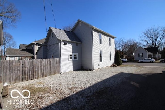 view of side of property with fence