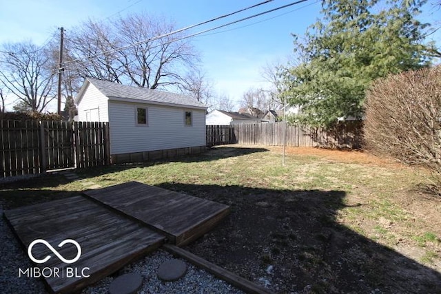 view of yard featuring an outbuilding and a fenced backyard