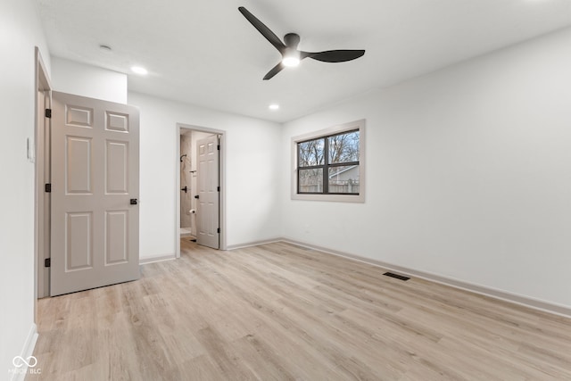 unfurnished bedroom featuring light wood finished floors, visible vents, baseboards, recessed lighting, and ensuite bathroom