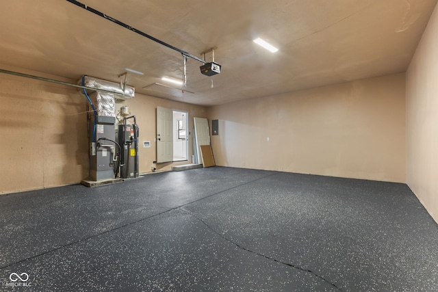 garage featuring heating unit, a garage door opener, and water heater