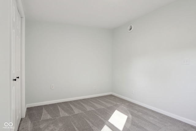 unfurnished bedroom featuring carpet and baseboards