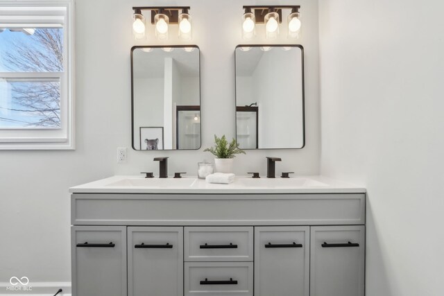 bathroom featuring double vanity and a sink