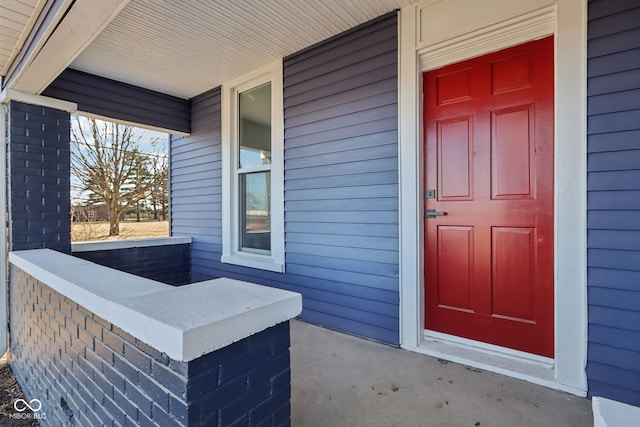 property entrance featuring covered porch