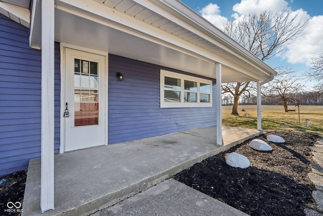 doorway to property with a patio area