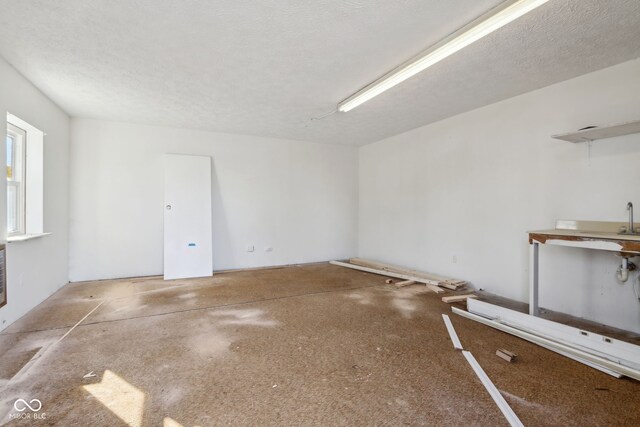 spare room featuring a textured ceiling