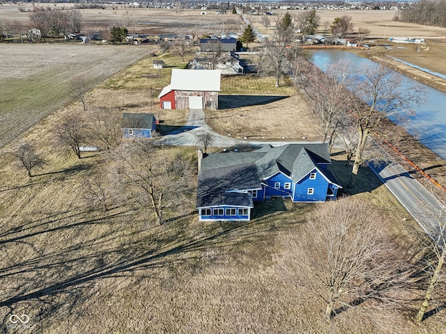 birds eye view of property with a rural view