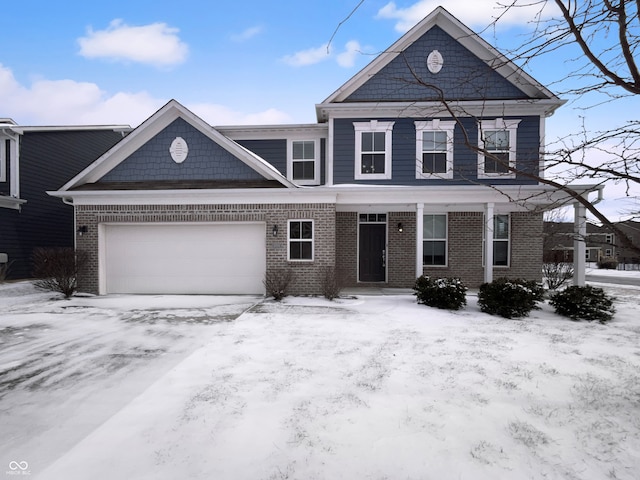 view of front of property featuring brick siding and an attached garage