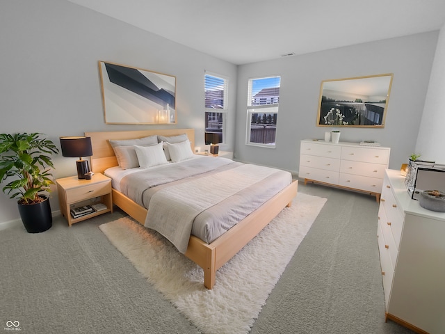 carpeted bedroom with visible vents