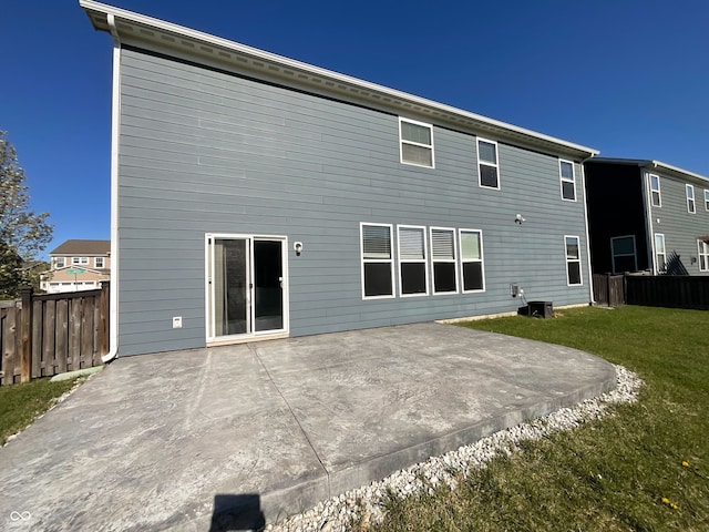 15704 Millwood Dr, Noblesville, IN 46060 - back of property with fence, a lawn, and a patio