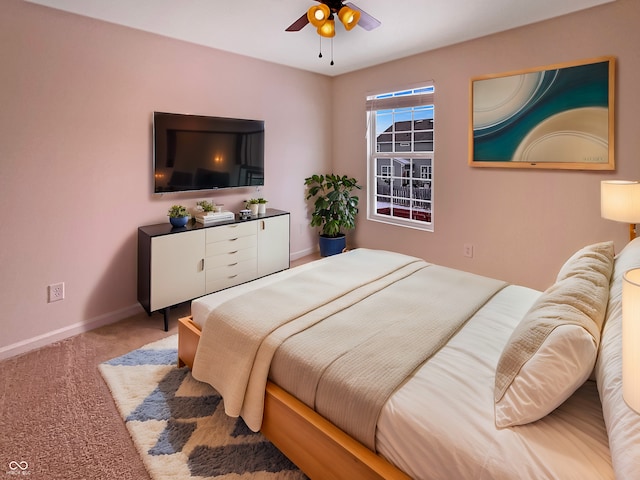 bedroom featuring carpet flooring, a ceiling fan, and baseboards