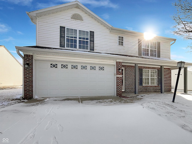 traditional home with brick siding and an attached garage