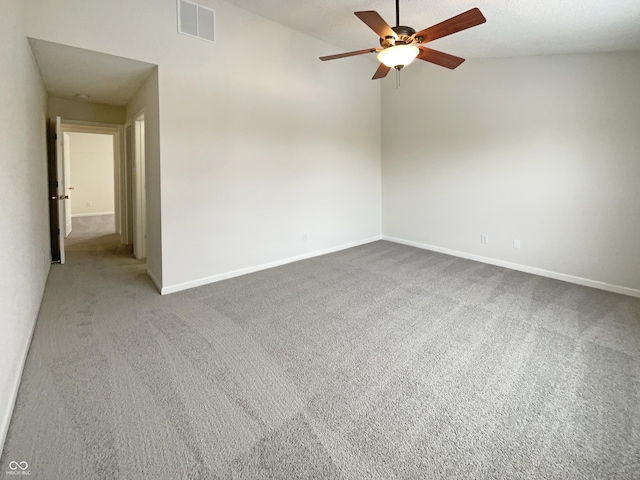 unfurnished room featuring a ceiling fan, carpet flooring, baseboards, and visible vents