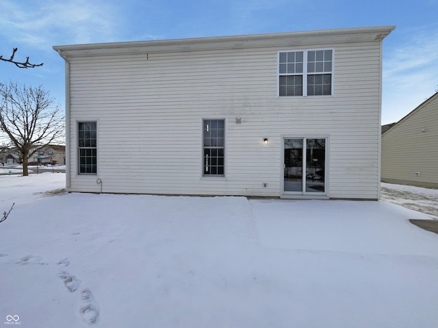 view of snow covered house