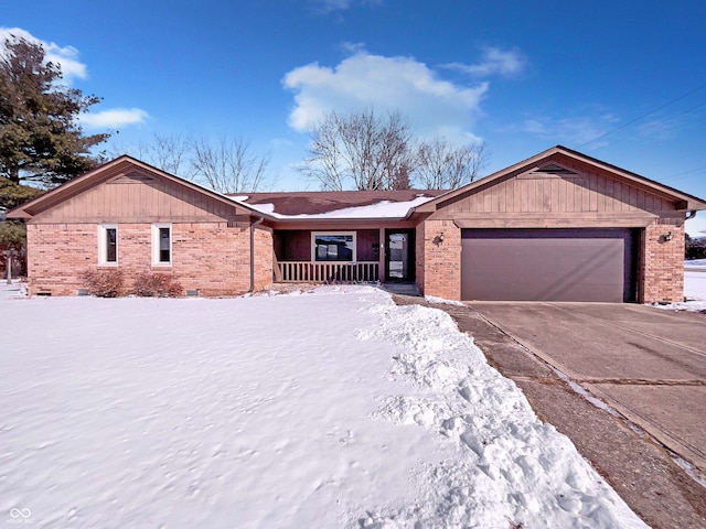 ranch-style house featuring concrete driveway, brick siding, and crawl space