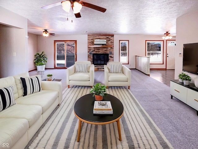 carpeted living room featuring a textured ceiling and a brick fireplace