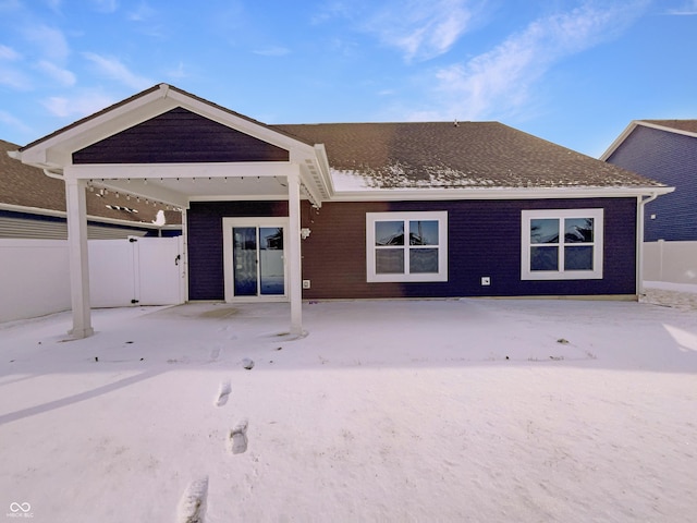 back of house featuring a patio area and fence